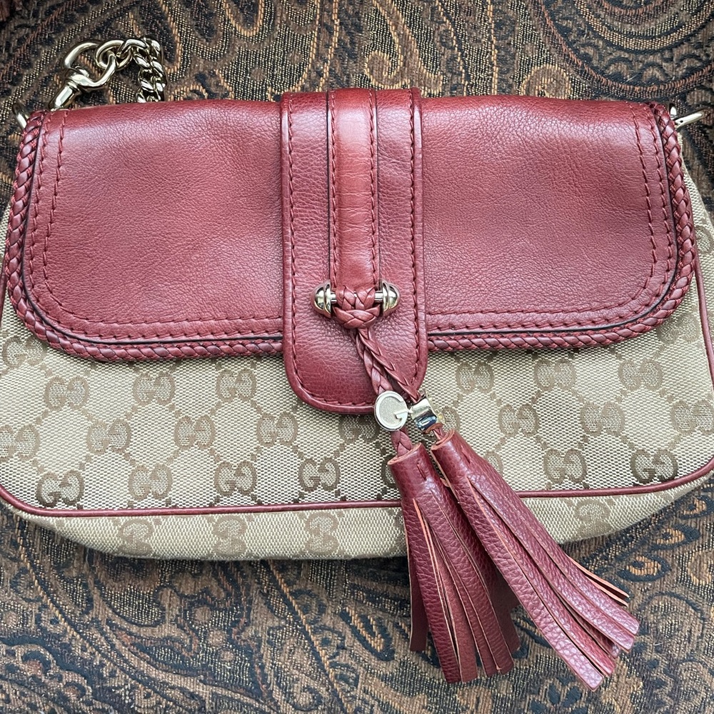 Authentic Gucci clutch shoulder bag w/ gold chain.
